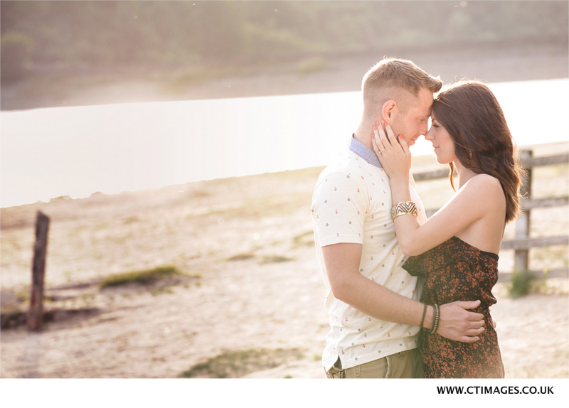 engagement-couple-pose-at-anglezarke-beach-in-bolton