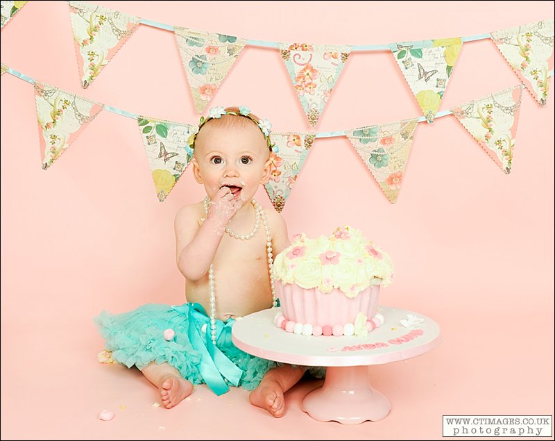 baby girl with birthday cake,