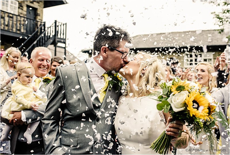 bolton-wedding-photography-7.jpg wedding confetti, bride kisses groom, wedding photo, bolton wedding photography,