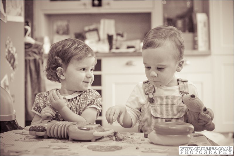 vintage photograph, children baking, boy and girl in kitchen,