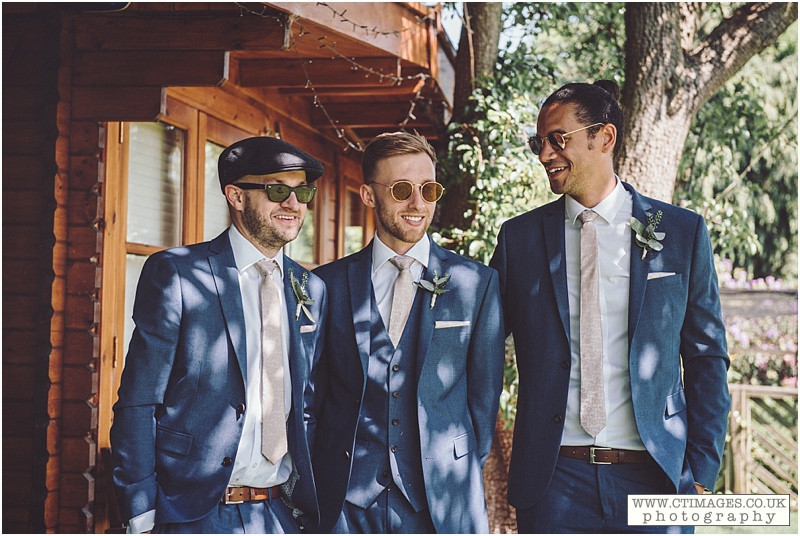 bridegroom,groom and ushers,groom in blue,two best men,wedding photos,